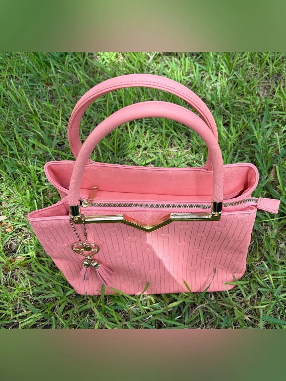 Crossi Pink Structured Heart-Embossed Tote Bag with Tassel Charm